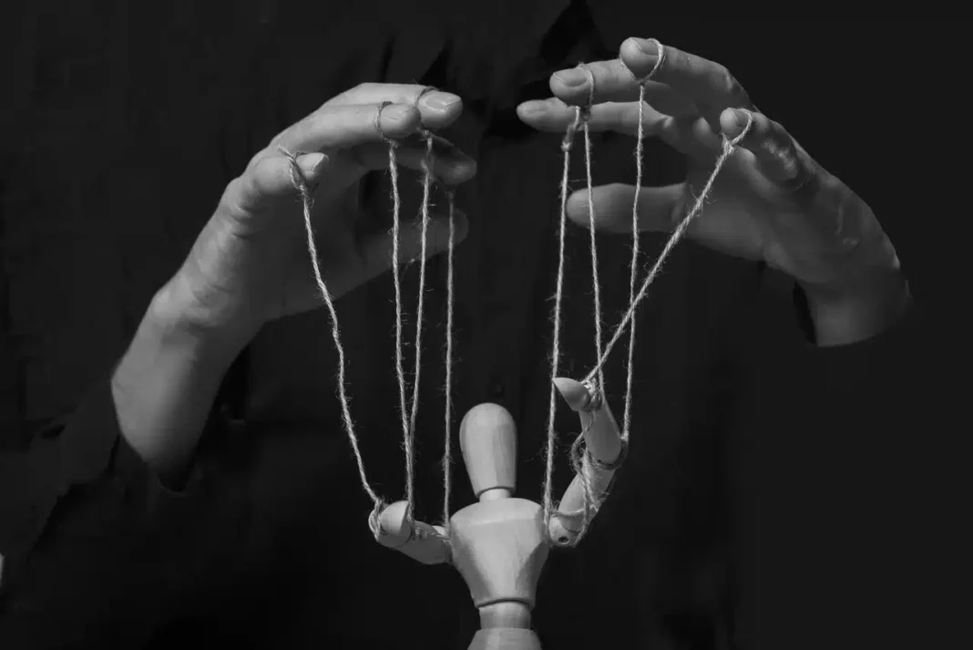 hands-manipulating-puppet-master.jpg